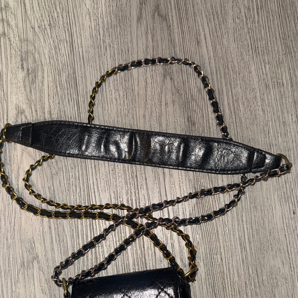 CHANEL Black Quilted Mini Bag with Gold Accents